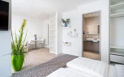 Ein Bett oder Betten in einem Zimmer der Unterkunft NOVALIS Hotel Dresden by AURUM