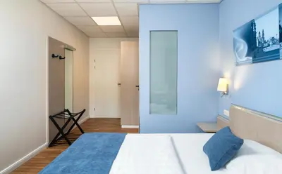 Ein Bett oder Betten in einem Zimmer der Unterkunft NOVALIS Hotel Dresden by AURUM