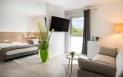 Ein Bett oder Betten in einem Zimmer der Unterkunft NOVALIS Hotel Dresden by AURUM