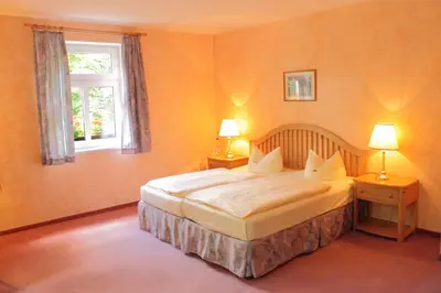 Ein Bett oder Betten in einem Zimmer der Unterkunft Landhaus Heidehof