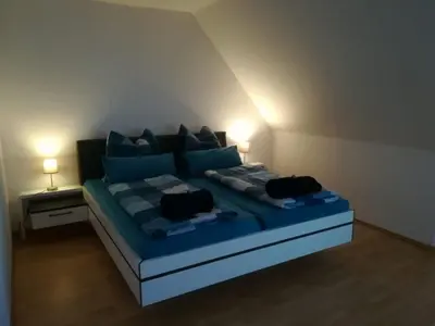 Ein Bett oder Betten in einem Zimmer der Unterkunft Ferienhaus Ostwald