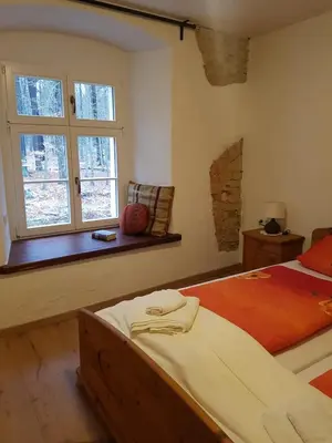 Ein Bett oder Betten in einem Zimmer der Unterkunft Gästehaus Vergissmeinnicht