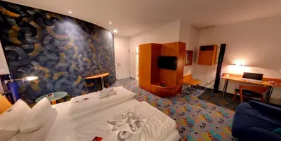 Ein Bett oder Betten in einem Zimmer der Unterkunft Business-Hotel Artes