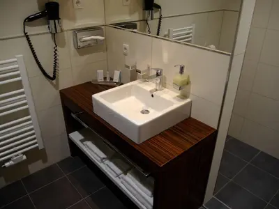Ein Badezimmer in der Unterkunft Business-Hotel Artes