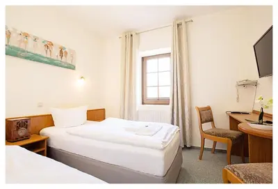 Ein Bett oder Betten in einem Zimmer der Unterkunft Hotel Hähnel