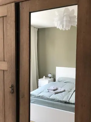 Ein Bett oder Betten in einem Zimmer der Unterkunft Ferienwohnung New Town