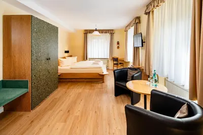 Ein Bett oder Betten in einem Zimmer der Unterkunft Landhaus Purschenstein