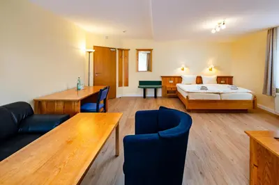 Ein Bett oder Betten in einem Zimmer der Unterkunft Landhaus Purschenstein