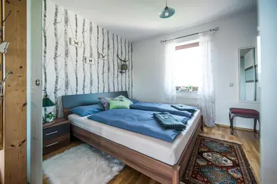 Ein Bett oder Betten in einem Zimmer der Unterkunft Hussi's Home