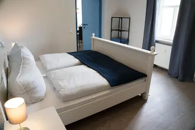Ein Bett oder Betten in einem Zimmer der Unterkunft Urlaubsfreude Biedermann Haus Glücksstein Ferienwohnung Aquamarin