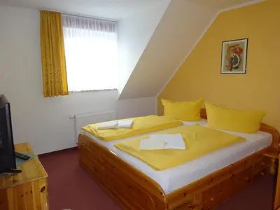 Ein Bett oder Betten in einem Zimmer der Unterkunft Pension Sigwarth