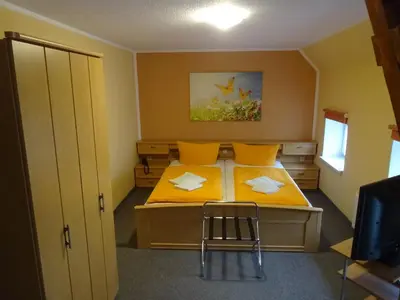 Ein Bett oder Betten in einem Zimmer der Unterkunft Pension Sigwarth