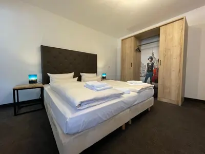 Ein Bett oder Betten in einem Zimmer der Unterkunft Maisonette-Apartment An der Frauenkirche