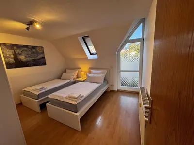 Ein Bett oder Betten in einem Zimmer der Unterkunft Ferienwohnung am Jacobsweg