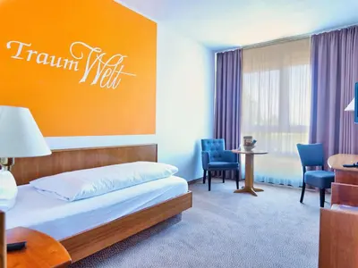 Ein Bett oder Betten in einem Zimmer der Unterkunft Hotel Sportwelt Radeberg