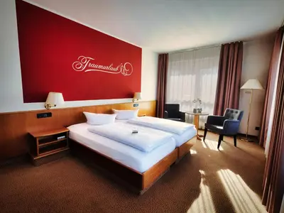 Ein Bett oder Betten in einem Zimmer der Unterkunft Hotel Sportwelt Radeberg