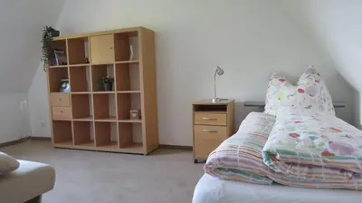 Ein Bett oder Betten in einem Zimmer der Unterkunft Ferienhaus Elbsommer am Weinberg II