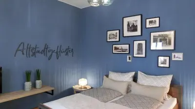 Ein Bett oder Betten in einem Zimmer der Unterkunft Pirna Altstadtgeflüster