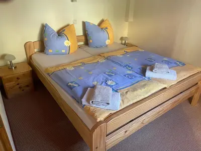 Ein Bett oder Betten in einem Zimmer der Unterkunft Ferienhaus Schmidt