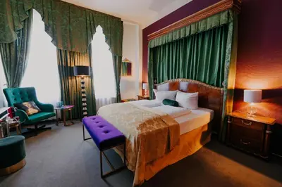 Ein Bett oder Betten in einem Zimmer der Unterkunft Boutique Hotel Rothenburger Hof