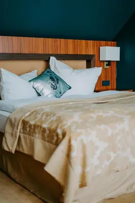 Ein Bett oder Betten in einem Zimmer der Unterkunft Boutique Hotel Rothenburger Hof