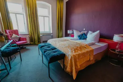 Ein Bett oder Betten in einem Zimmer der Unterkunft Boutique Hotel Rothenburger Hof