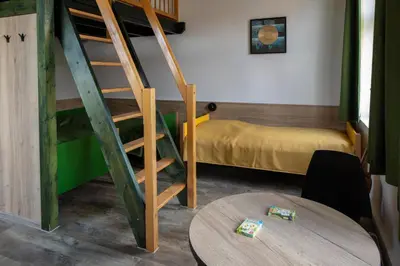 Ein Bett oder Betten in einem Zimmer der Unterkunft Gästehaus Dresden - Alte Schule Gohlis