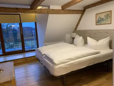 Ein Bett oder Betten in einem Zimmer der Unterkunft Hotel Berghof Lichtenhain