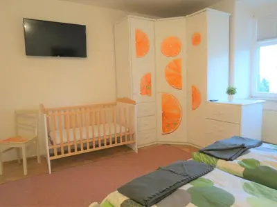 Ein Bett oder Betten in einem Zimmer der Unterkunft Penthouse Wolkenstein großzügige Maisonette auf 155 qm mit Whirlpool, Klima & Kamin
