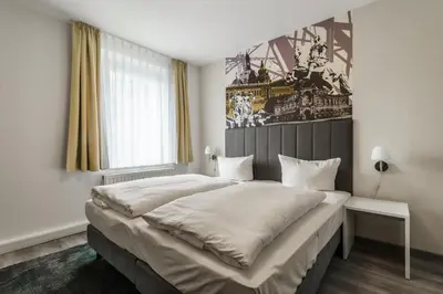 Ein Bett oder Betten in einem Zimmer der Unterkunft Familienapartment nahe der Frauenkirche