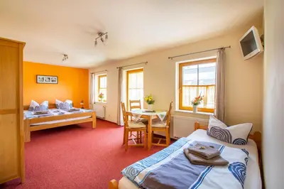 Ein Bett oder Betten in einem Zimmer der Unterkunft Pension Ferienhof Fischer