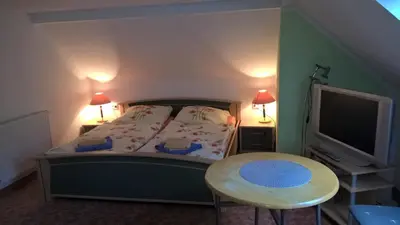 Ein Bett oder Betten in einem Zimmer der Unterkunft Pension Zschirnsteinbaude