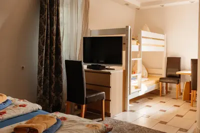 Ein Bett oder Betten in einem Zimmer der Unterkunft Pension Zschirnsteinbaude