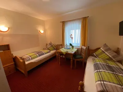 Ein Bett oder Betten in einem Zimmer der Unterkunft Kastanienhof