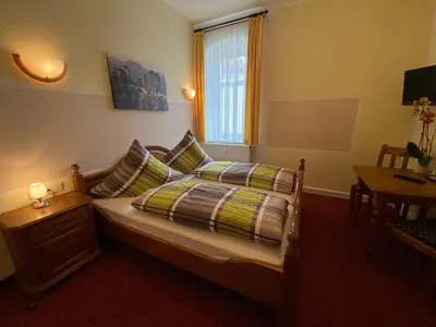 Ein Bett oder Betten in einem Zimmer der Unterkunft Kastanienhof
