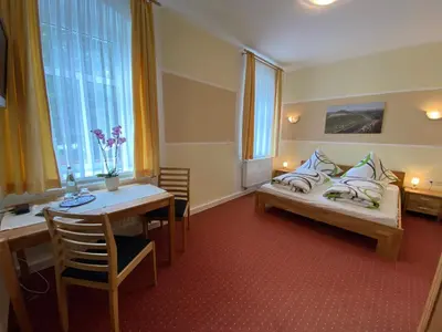 Ein Bett oder Betten in einem Zimmer der Unterkunft Kastanienhof