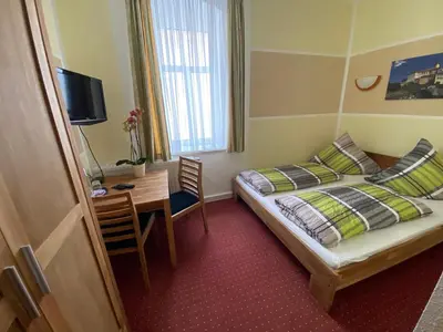 Ein Bett oder Betten in einem Zimmer der Unterkunft Kastanienhof