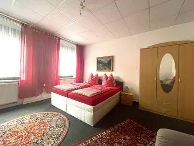 Ein Bett oder Betten in einem Zimmer der Unterkunft Ferienwohnung NEUMANN a.d. Porzellan-Manufaktur