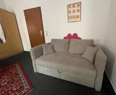 Ein Sitzbereich in der Unterkunft Ferienwohnung NEUMANN a.d. Porzellan-Manufaktur