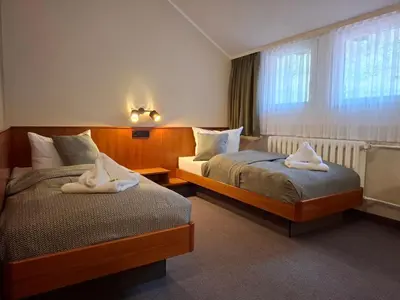 Ein Bett oder Betten in einem Zimmer der Unterkunft Hotel Burgblick Meißen