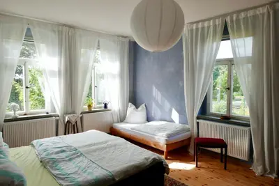 Ein Bett oder Betten in einem Zimmer der Unterkunft Ferienwohnung ANDERE ZEITEN