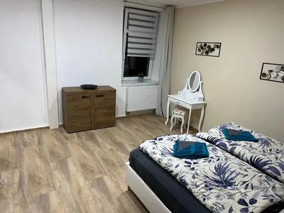 Ein Bett oder Betten in einem Zimmer der Unterkunft Apartments Badallee 4