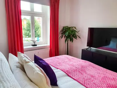 Ein Bett oder Betten in einem Zimmer der Unterkunft PB Ferienwohnungen - FeWo 6 - Stilvoll eingerichtetes Apartment im Herzen Senftenbergs