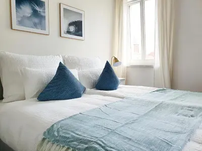 Ein Bett oder Betten in einem Zimmer der Unterkunft PB Ferienwohnungen - FeWo 7 - Stilvoll eingerichtetes Apartment im Herzen Senftenbergs