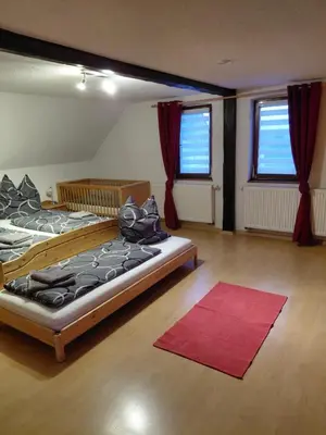 Ein Bett oder Betten in einem Zimmer der Unterkunft Einkehr zur Rennstrecke