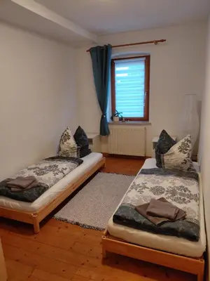 Ein Bett oder Betten in einem Zimmer der Unterkunft Einkehr zur Rennstrecke