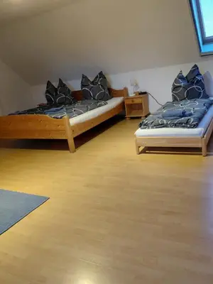 Ein Bett oder Betten in einem Zimmer der Unterkunft Einkehr zur Rennstrecke