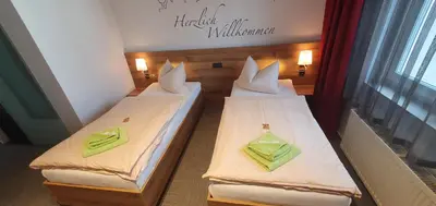 Ein Bett oder Betten in einem Zimmer der Unterkunft Hotel Wettiner Hof