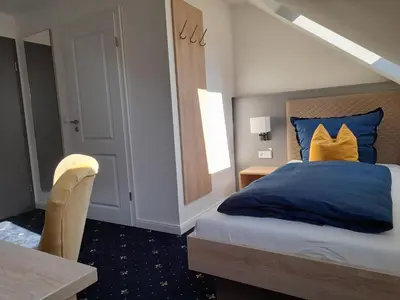 Ein Bett oder Betten in einem Zimmer der Unterkunft Gästehaus Weinberge