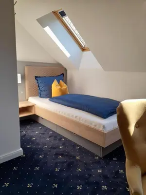 Ein Bett oder Betten in einem Zimmer der Unterkunft Gästehaus Weinberge